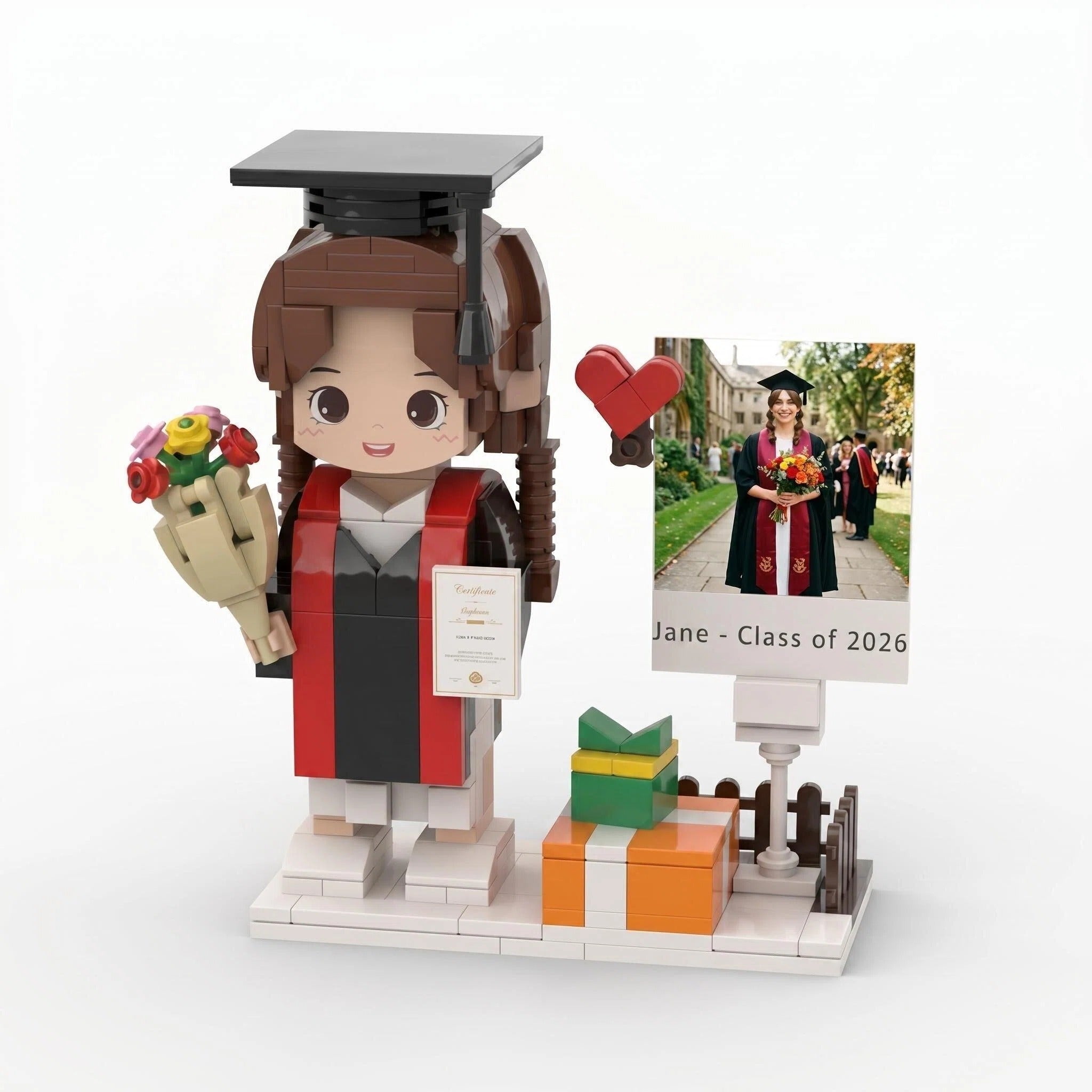 Graduation-themed figure with a gift, flowers, and a scroll, set against a white background.