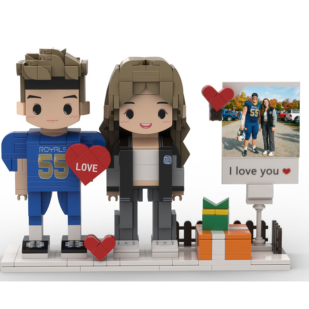 Brick figure of a couple with hearts and a photo frame on a white background