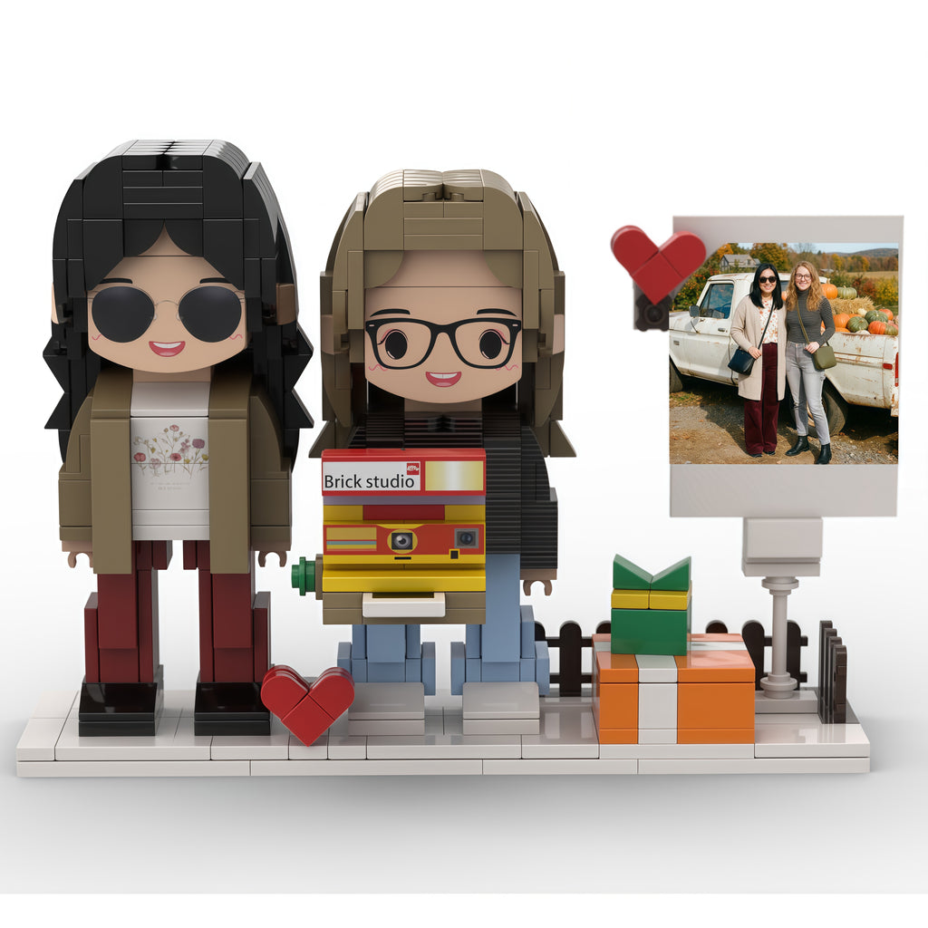 Two brick figures of people with accessories on a white background, with a smaller inset photo frame.
