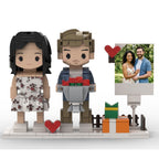 Brick figure of a couple with a heart and a photo frame on a white background